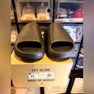 Adidas Yeezy slide onix 
purchased in Confirmed app. Size 12 in men’s
Never worn